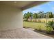 Private backyard patio with pavers and lush landscaping at 20363 Symphony Pl, Venice, FL 34293