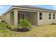 Covered patio with a grassy backyard at 20363 Symphony Pl, Venice, FL 34293