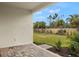 Spacious backyard with grassy lawn and paved patio at 20375 Symphony Pl, Venice, FL 34293