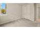 Bedroom with carpet, window, and closet at 20375 Symphony Pl, Venice, FL 34293