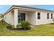 Well-maintained house exterior with covered patio at 20375 Symphony Pl, Venice, FL 34293