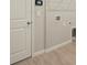 Bright laundry room with tile flooring and modern finishes at 20375 Symphony Pl, Venice, FL 34293