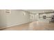 Open living room with tile floors and neutral color palette at 20375 Symphony Pl, Venice, FL 34293