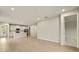 Open living room and kitchen area with tile floors and neutral walls at 20375 Symphony Pl, Venice, FL 34293