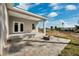 Covered patio with fire pit and spacious backyard at 6454 Freeport Dr, Spring Hill, FL 34608