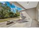 Covered patio with fire pit and spacious backyard at 6454 Freeport Dr, Spring Hill, FL 34608