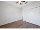 Spacious bedroom with wood-look floors and white closet doors at 6454 Freeport Dr, Spring Hill, FL 34608