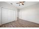 Bedroom with double doors and wood-look floors at 6454 Freeport Dr, Spring Hill, FL 34608