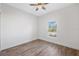 Simple bedroom with hardwood floors and a window at 6454 Freeport Dr, Spring Hill, FL 34608