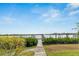 Private walkway to a dock with scenic waterfront view at 6613 Seabird Way, Apollo Beach, FL 33572