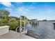 Private dock with a convenient boat lift and ladder at 6613 Seabird Way, Apollo Beach, FL 33572