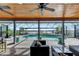 Relaxing pool area with water view, covered patio, and comfortable seating at 6613 Seabird Way, Apollo Beach, FL 33572