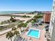 Aerial view of beach, pool, and building at 11000 Gulf Blvd # 703, Treasure Island, FL 33706