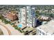 Aerial view of beachfront highrise building with pool and surrounding area at 11000 Gulf Blvd # 703, Treasure Island, FL 33706