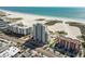 Aerial view showing building's location near beach and highway at 11000 Gulf Blvd # 703, Treasure Island, FL 33706