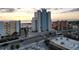Aerial view of beachfront highrise building with ocean and beach views at sunset at 11000 Gulf Blvd # 703, Treasure Island, FL 33706