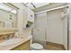 Bathroom with shower and granite countertop at 11000 Gulf Blvd # 703, Treasure Island, FL 33706