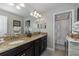 Bathroom with double vanity and granite countertop at 19218 Alexandrea Lee Ct, Land O Lakes, FL 34638