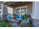 Cozy front porch with wicker furniture and potted plants at 19218 Alexandrea Lee Ct, Land O Lakes, FL 34638