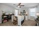 Home office with built-in shelving and a spacious work island at 19218 Alexandrea Lee Ct, Land O Lakes, FL 34638