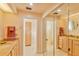 Bright bathroom with dual sinks, walk-in closet, and toilet at 411 Belle Isle Ave, Belleair Beach, FL 33786