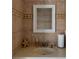 Small bathroom with updated sink and fixtures at 411 Belle Isle Ave, Belleair Beach, FL 33786