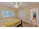 Comfortable bedroom with ceiling fan and large closet at 411 Belle Isle Ave, Belleair Beach, FL 33786