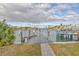 Private dock with walkway to the water at 411 Belle Isle Ave, Belleair Beach, FL 33786