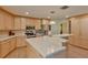 Modern kitchen with large island, stainless steel appliances, and granite countertops at 411 Belle Isle Ave, Belleair Beach, FL 33786