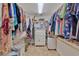 Large walk-in closet with ample hanging space and drawers at 411 Belle Isle Ave, Belleair Beach, FL 33786