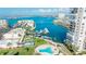 Resort-style community; aerial view shows pool, marina, and building at 7400 Sun Island Dr # 501, South Pasadena, FL 33707