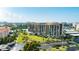 Aerial view of a condo building near the water with lush landscaping at 7400 Sun Island Dr # 501, South Pasadena, FL 33707