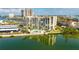 Condo building, pool, and water reflection in aerial view at 7400 Sun Island Dr # 501, South Pasadena, FL 33707