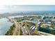 Aerial view showing waterfront property, bridge, and surrounding city at 7400 Sun Island Dr # 501, South Pasadena, FL 33707
