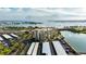 Aerial view showcasing condo building, parking, and waterfront location at 7400 Sun Island Dr # 501, South Pasadena, FL 33707