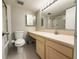 Clean bathroom with a vanity, toilet, and tiled floors at 7400 Sun Island Dr # 501, South Pasadena, FL 33707