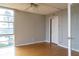 Well-lit bedroom with hardwood floors and large windows offering an outdoor view at 7400 Sun Island Dr # 501, South Pasadena, FL 33707
