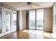 Spacious bedroom with hardwood floors, mirrored doors and access to a balcony at 7400 Sun Island Dr # 501, South Pasadena, FL 33707