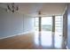 Living room features hardwood floors and large windows at 7400 Sun Island Dr # 501, South Pasadena, FL 33707