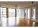 Living room with hardwood floors and balcony access at 7400 Sun Island Dr # 501, South Pasadena, FL 33707