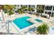 Relaxing pool and spa area with ample lounge chairs at 7400 Sun Island Dr # 501, South Pasadena, FL 33707