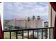 Stunning view of the ocean, pool, and surrounding buildings from a balcony at 7400 Sun Island Dr # 501, South Pasadena, FL 33707