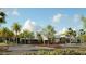 Modern building exterior with parking lot and landscaping at 9698 Runaway Breeze Dr, Land O Lakes, FL 34637