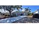 Single-story home with landscaped yard and driveway at 1333 Misty Greens Dr, Sun City Center, FL 33573