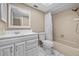 Neutral bathroom with a shower-tub combo, toilet, and vanity sink at 2233 Curlew Rd, Dunedin, FL 34698