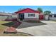 Charming single-Gathering home with red trim and a well-maintained front yard at 2233 Curlew Rd, Dunedin, FL 34698