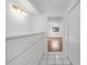 Hallway featuring storage, modern lighting and flooring at 2233 Curlew Rd, Dunedin, FL 34698