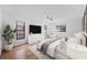 Comfortable main bedroom with a ceiling fan, large bed, and decorative plants at 2233 Curlew Rd, Dunedin, FL 34698