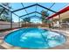 Screened-in pool area offering privacy and enjoyment at 2233 Curlew Rd, Dunedin, FL 34698