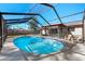 Enjoy the Florida weather in this home's screened-in pool at 2233 Curlew Rd, Dunedin, FL 34698